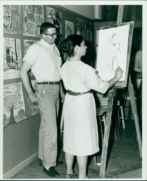 Henry Peacock supervising a drawing student at the Delaware Art Center, 1961. Delaware Art Muse…