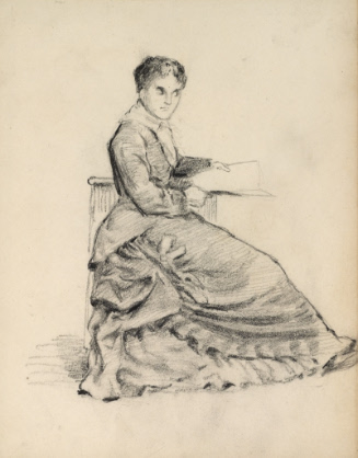 Woman seated with paper