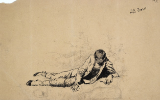 Man lying on ground, looking downward